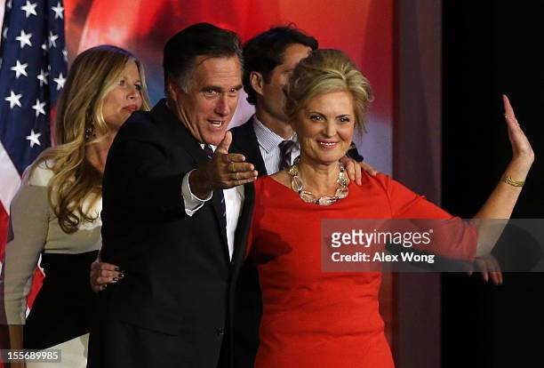 Republican presidential candidate, Mitt Romney, wife, Ann Romney, wave to the crowd on stage after conceding the presidency during Mitt Romney's...