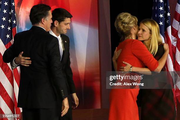 Republican presidential candidate, Mitt Romney greets Republican vice presidential candidate, U.S. Rep. Paul Ryan on stage while his wife, Ann...