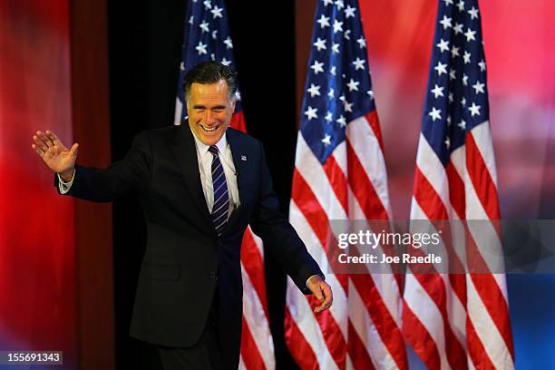 Republican presidential candidate, Mitt Romney, waves to the crowd before conceding the presidency during Mitt Romney's campaign election night event...