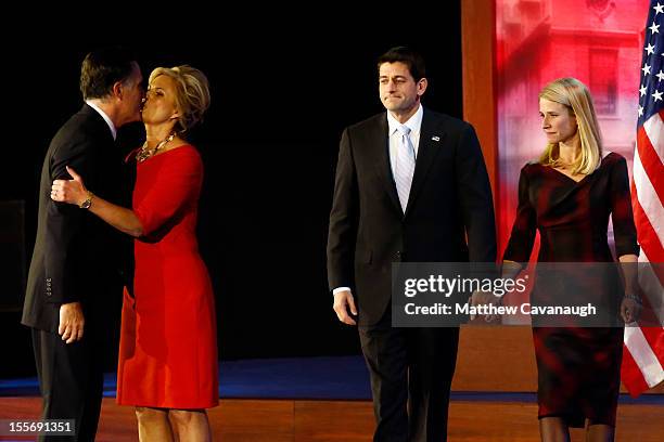 Republican presidential candidate, Mitt Romney, kisses his wife, Ann Romney, in front of Republican vice presidential candidate, U.S. Rep. Paul Ryan...