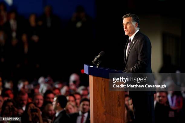 Republican presidential candidate, Mitt Romney, speaks at the podium as he concedes the presidency during Mitt Romney's campaign election night event...