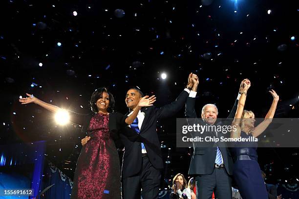President Barack Obama stands on stage with first lady Michelle Obama, U.S. Vice President Joe Biden and Dr. Jill Biden after his victory speech on...