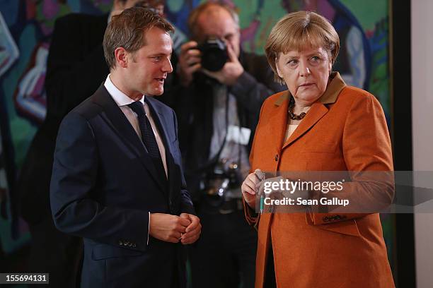 German Chancellor Angela Merkel chats with Health Minister Daniel Bahr prior to the weekly German government cabinet meeting on November 7, 2012 in...
