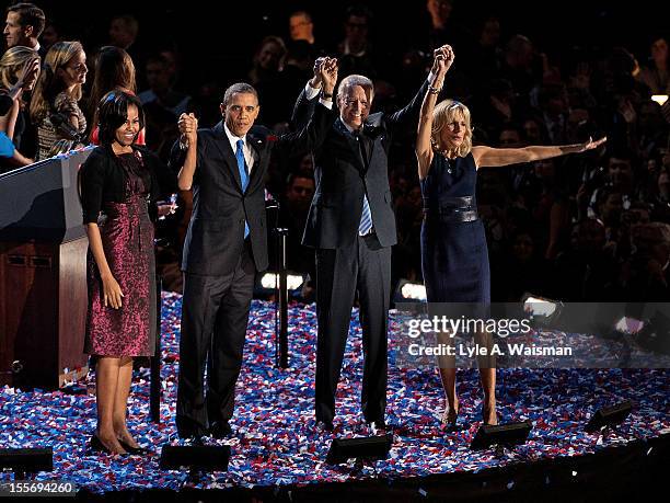 President Barack Obama stands on stage with first lady Michelle Obama, U.S. Vice President Joe Biden and Dr. Jill Biden after his victory speech on...