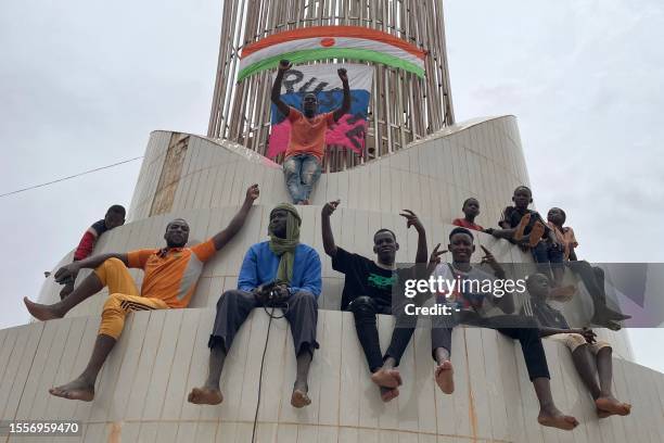 Supporters of the Nigerien defence and security forces gather during a demonstration outside the national assembly in Niamey on July 27, 2023. The...