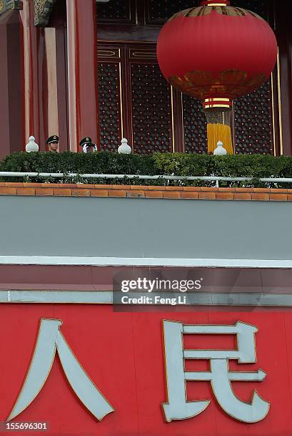Two Chinese paramilitary policemen monitor the square with telescope on the Tiananmen Gate on November 7, 2012 in Beijing, China. The18th National...