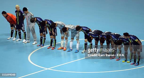 Players of Japan celebrate after winning the FIFA Futsal World Cup Group C match between Japan and Libya at Indoor Stadium Huamark on November 7,...