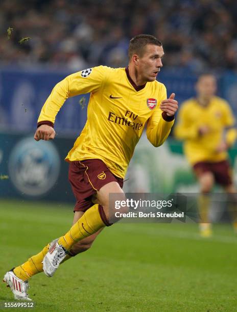 Lukas Podolski of Arsenal runs during the UEFA Champions League group B match between FC Schalke 04 and Arsenal FC at Veltins-Arena on November 6,...