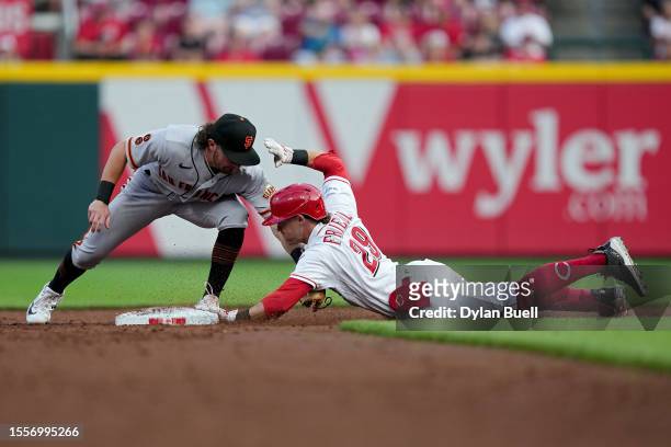 Friedl of the Cincinnati Reds reaches second base for a double past Brett Wisely of the San Francisco Giants in the third inning at Great American...
