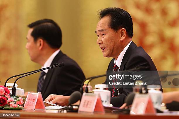 Cai Mingzhao, spokesman of the 18th CPC National Congress answers a question during a news conference at The Great Hall Of The People on November 7,...