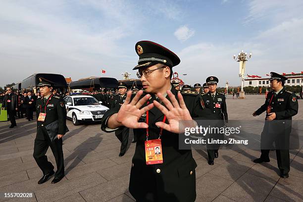 Soldier try to prevent photos taken at Tiananmen Square on November 7, 2012 in Beijing, China. The18th National Congress of the Communist Party of...