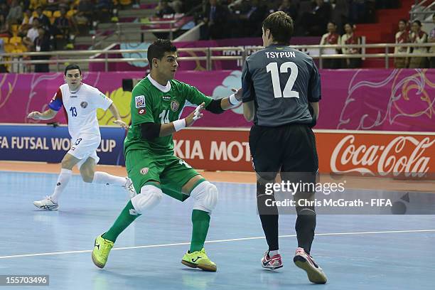 Costa Rica goalkeeper Alvaro Santamaria pushes into Ukraine goalkeeper Kyrylo Tsypun during the FIFA Futsal World Cup, Group A match between Costa...