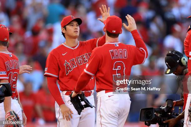 Taylor Ward and Shohei Ohtani of the Los Angeles Angels celebrate after defeating the New York Yankees 7-3 in a game at Angel Stadium of Anaheim on...