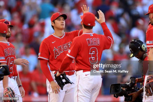 Taylor Ward and Shohei Ohtani of the Los Angeles Angels celebrate after defeating the New York Yankees 7-3 in a game at Angel Stadium of Anaheim on...