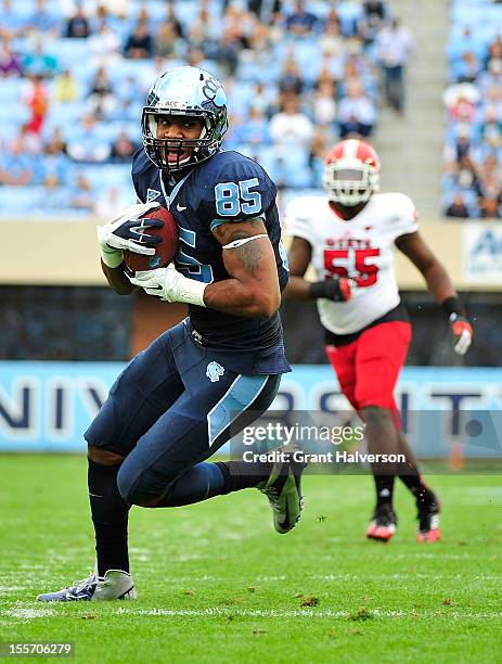 Eric Ebron of the North Carolina Tar Heels makes a catch against the North Carolina State Wolfpack during play at Kenan Stadium on October 27, 2012...