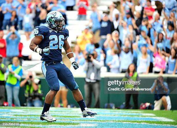 Giovani Bernard of the North Carolina Tar Heels celebrates after scoring a touchdown against the North Carolina State Wolfpack during play at Kenan...