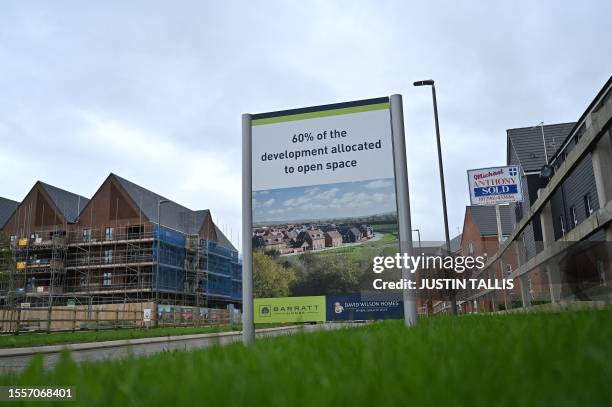 Residential properties are pictured at a Barratt and David Wilson construction site for new houses and homes near Aylesbury, on July 27, 2023....