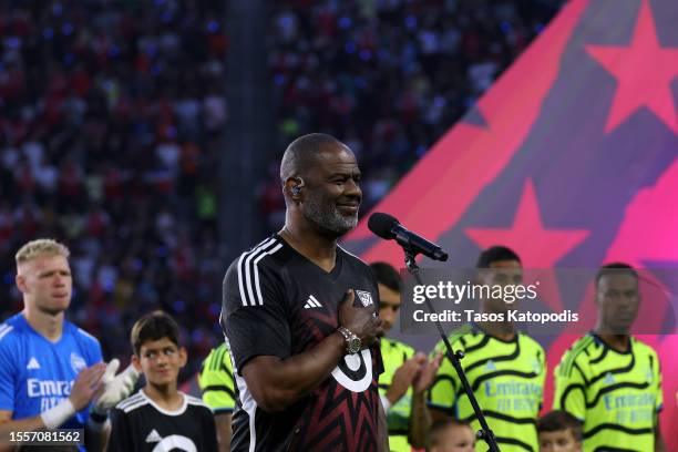 Brian McKnight sings the United States National Anthem prior to the MLS All-Star Game between Arsenal FC and MLS All-Stars at Audi Field on July 19,...