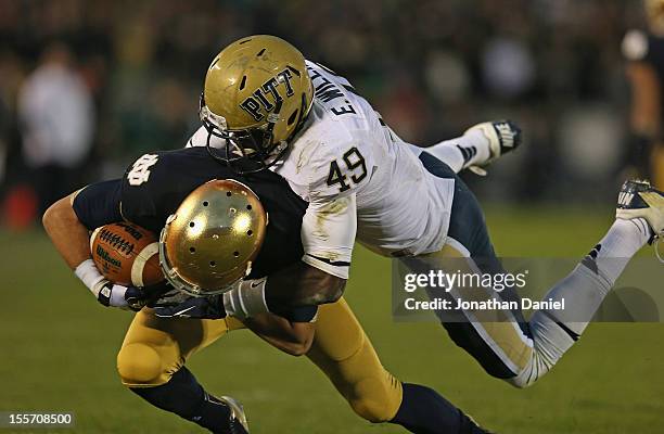 Robby Toma of the Notre Dame Fighting Irish is tackled by eric Williams of the Pittsburgh Panthers at Notre Dame Stadium on November 3, 2012 in South...
