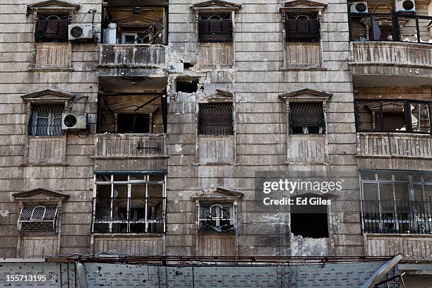 An apartment block shows damage from recent artillery fire near the Salahudeen district on November 1, 2012 in Aleppo, Syria. The Shohada al Haq, or...