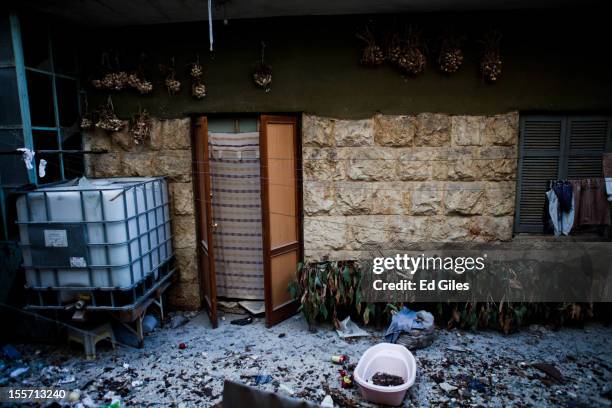 Debris from recent fighting litters the courtyard of an abandoned apartment on the front line near the Salahudeen district on November 1, 2012 in...