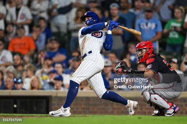 Nico Hoerner of the Chicago Cubs hits a grand slam in the eighth inning against the Washington Nationals at Wrigley Field on July 19, 2023 in...