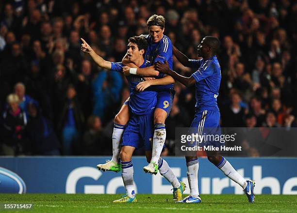 Oscar of Chelsea celebrates his goal with Fernando Torres and Ramires during the UEFA Champions League Group E match between Chelsea and Shakhtar...