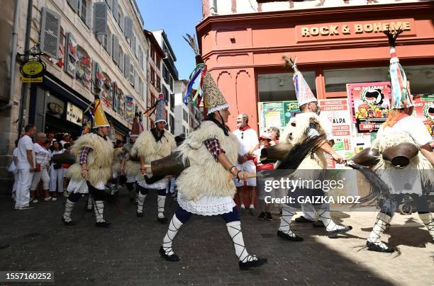 The "Joaldunak" or bell ringers parade in a street during the festival in Bayonne, southwestern France, on July 27, 2023.