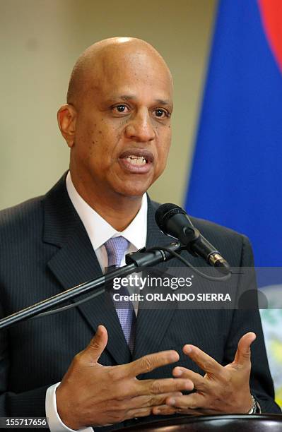 Belize's PM Dean Oliver Barrow answers questions to the press after signing a joint declaration with Honduran President Porfirio Lobo in Tegucigalpa,...