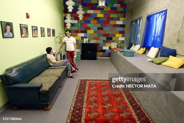 Robert Lopez , a.k.a. "El Vez", talks with a friend at the Amoeba Music lounge before entering the stage to perform in the musician Kristian...