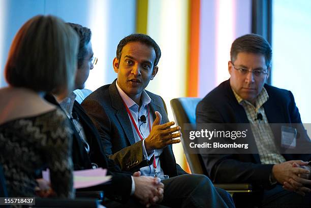 Gibu Thomas, senior vice president of mobile and digital for Wal-Mart Stores Inc., second right, speaks while Kym McNicholas, executive producer at...