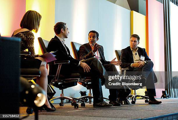 Gibu Thomas, senior vice president of mobile and digital for Wal-Mart Stores Inc., second right, speaks while Kym McNicholas, executive producer at...