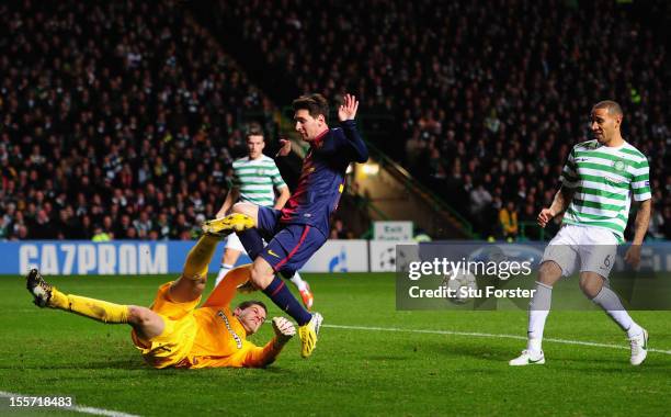 Celtic goalkeeper Fraser Forster denys Barcelona player Lionel Messi during the UEFA Champions League Group G match between Celtic and Barcelona at...