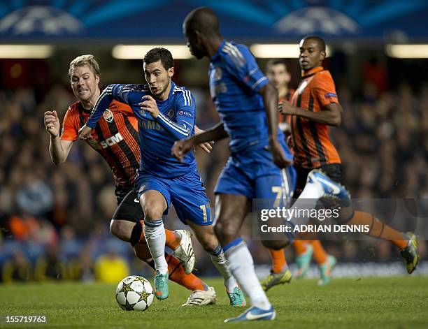 Chelsea's Belgian player Eden Hazard vies for the ball against Shakhtar Donetsk's Tomas Hubschman during the UEFA Champions League Group E football...