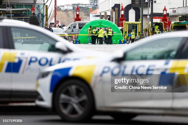 Police officers cordon off an area near the site of a shooting on July 20, 2023 in Auckland, New Zealand. Three people, including the gunman, were...