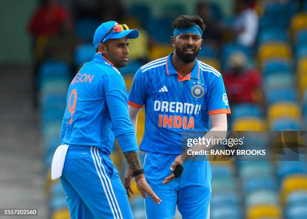 Hardik Pandya and Surya Kumar Yadav , of India, celebrate the dismissal of Kyle Mayers, of West Indies, during the first One Day International...