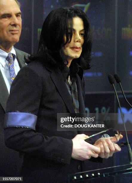 Musician Michael Jackson appears at the Nasdaq Marketsite in Times Square, New York 30 August 2001. Jackson celebrated his 43rd birthday yesterday....
