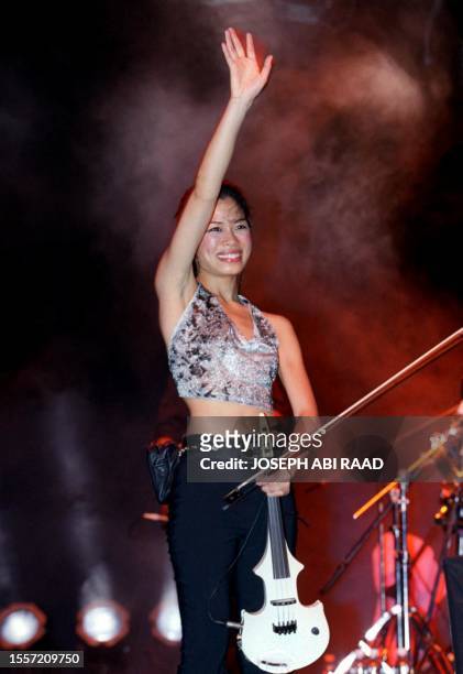 World famous violinist Vanessa Mae performs at Oceana beach club in Rmayleh, South of Beirut, late 21 August 2001. Vanessa sang and played selections...