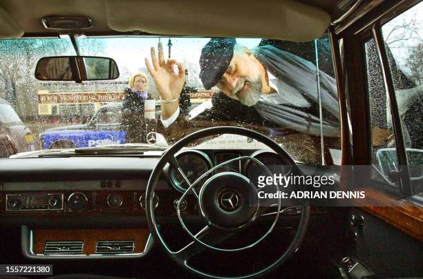 Musician Mick Fleetwood, of Fleetwood Mac fame, peers through the windscreen of Mercedes Benz 600 limousine formerly owned by John Lennon at The Hard...