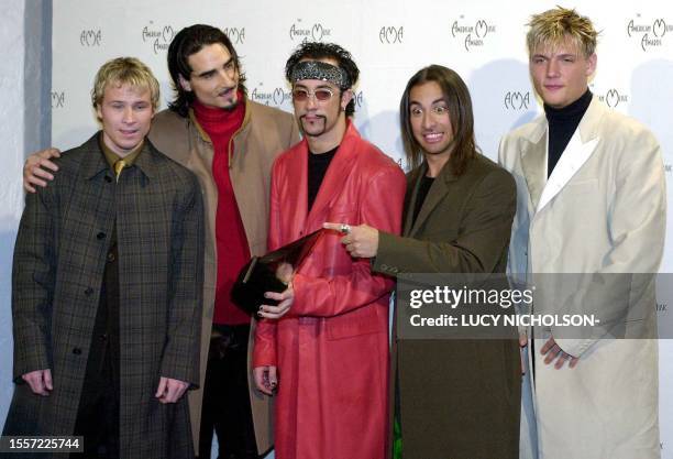 Nick Carter, Kevin Richardson, A.J. McLean, Howie Dorough, Brian Kittrell of the group Backstreet Boys pose with their award for Favorite Rock Band...