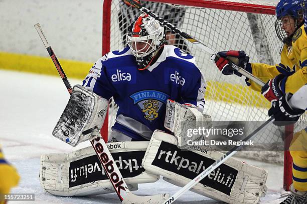 Juuse Saros of team Finland gets beat on a shot by Anton Karlsson of team Sweden late in the third period on November 7, 2012 at the Ice Cube arena...