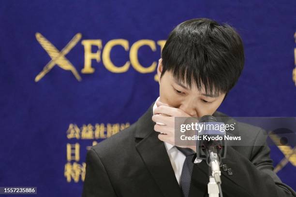 Chiang Hung-chieh, the Taiwanese ex-husband of retired Japanese table tennis star and Olympic medalist Ai Fukuhara, sheds tears at a press conference...