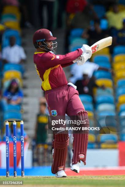 Brandon King of West Indies hits 4 during during the first One Day International cricket match between West Indies and India, at Kensington Oval in...