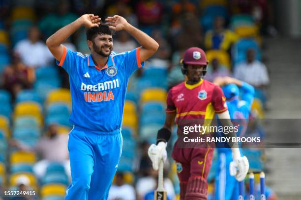 Shardul Thakur of India watches as Alick Athanaze of West Indies add to his score during the first One Day International cricket match between West...