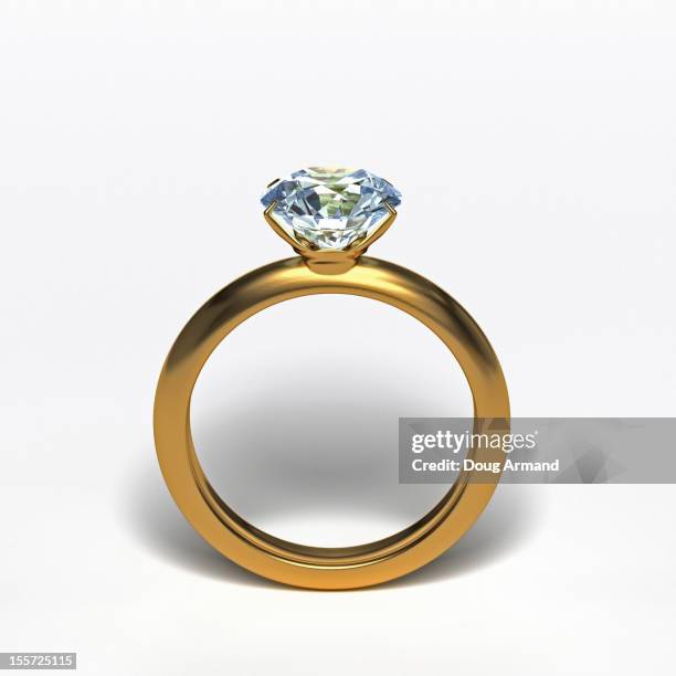 gold diamond ring upright on white surface - engagement ring stock-grafiken, -clipart, -cartoons und -symbole