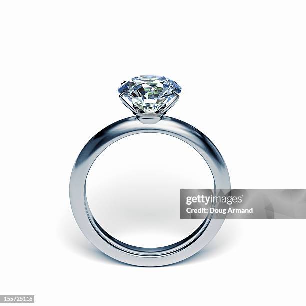 silver diamond ring upright on white surface - silver metal stock-grafiken, -clipart, -cartoons und -symbole