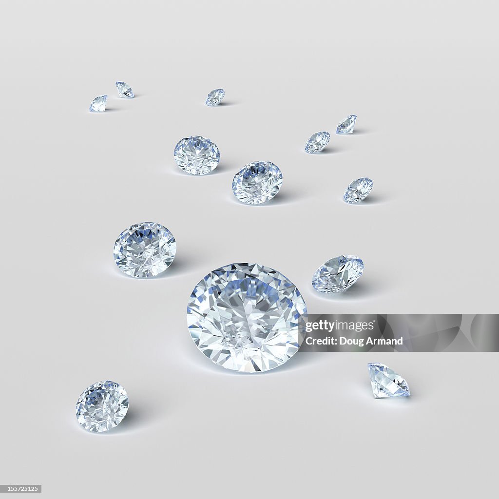 Cut diamonds on white surface