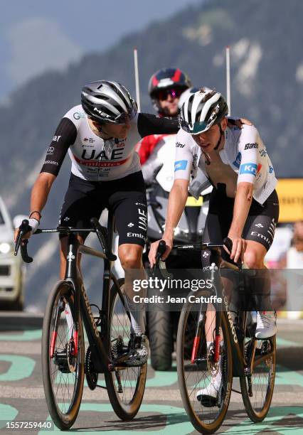 Marc Soler of Spain and UAE Team Emirates and teammate White jersey of best young rider Tadej Pogacar of Slovenia and UAE Team Emirates cross the...