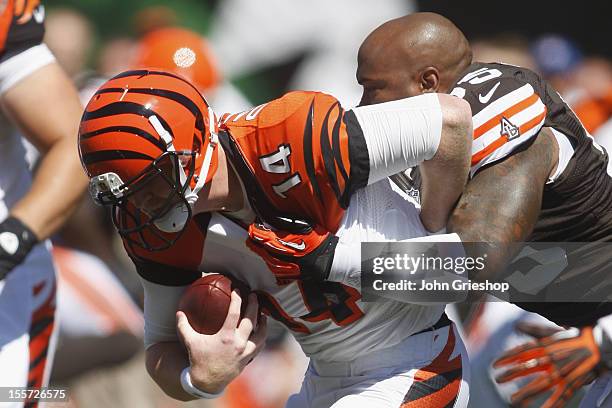 Juqua Parker of the Cleveland Browns makes the tackle on Andy Dalton of the Cincinnati Bengals during their game at Paul Brown Stadium on September...
