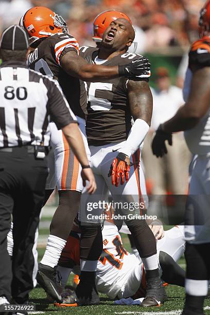 Juqua Parker of the Cleveland Browns celebrates making the tackle on Andy Dalton of the Cincinnati Bengals during their game at Paul Brown Stadium on...